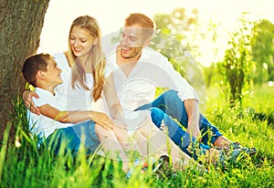 Joyful young family having fun outdoors