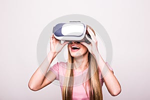 Joyful young girl using a VR headset