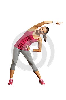 Joyful young woman doing exercises