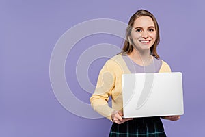 joyful young woman holding laptop isolated