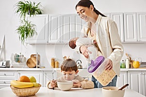 joyous attractive mother enjoying breakfast with