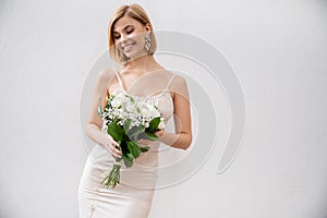 joyous and blonde bride in wedding