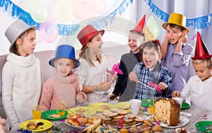 Joyous children happy to celebrate friend birthday