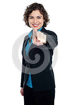 Joyous corporate woman pointing you out