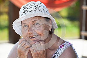 Joyous happy Caucasian senior woman face photo