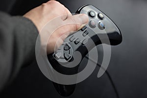 joystick in hand on a black background