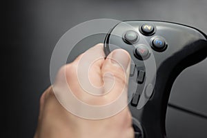 joystick in hand on a black background