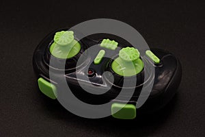Joystick toy green black background photo