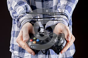 joystick wire wrapped around persons hands, video games addiction concept b