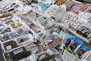 Fresh seafood and cooking ingredients on display at the Tsukiji fish market in Tokyo Japan