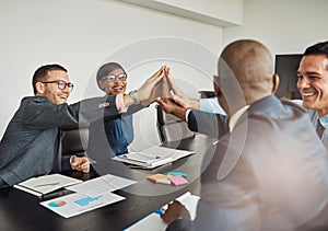 Jubilant multiracial business team cheering photo