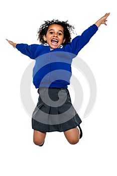 Jubilant school kid jumping high up in the air