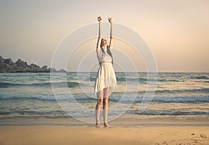 Jubilating girl at the seaside