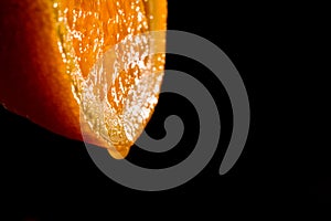 Jucy orange on black background