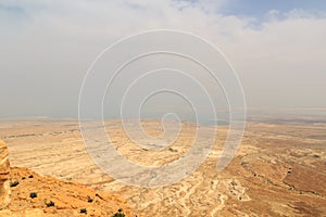 Judaean Desert panorama with wadis and salt lake dead sea seen from Masada fortress, Israel