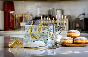 Judaism tradition holiday symbols for Hanukkah celebration, such as lighting hanukkiah menorah candles as symbols of the