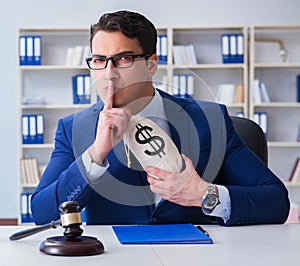 Judge in bribe concept with money