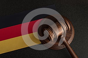 Judge gavel on background of the flag Germany. Law and justice. Constitutional law