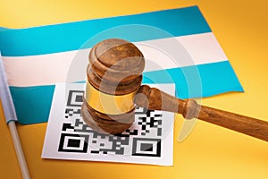 Judge gavel, barcode sheet and Argentine flag, concept of administrative punishment for violating QR codes in Argentina