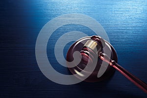 Judge gavel on a blue wooden background