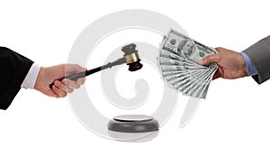 Judge with gavel and businessman with money