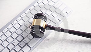 Judge gavel with computer keyboard. Concept of internet crime