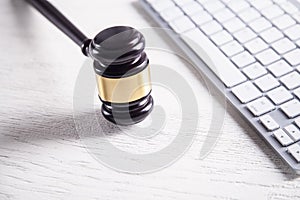 Judge gavel with computer keyboard. Concept of internet crime. Law and Justice