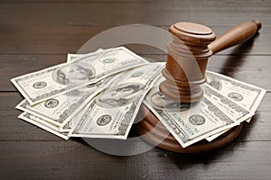 Judge gavel with dollars