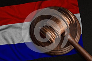 Judge Gavel and flag of Netherland. Law and justice in Holland. Violation of rights and freedoms