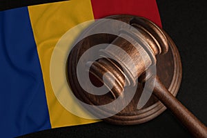 Judge Gavel and flag of Romania. Law and justice in Romania. Violation of rights and freedoms photo