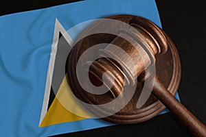 Judge Gavel and flag of Saint Lucia. Law and justice in 222. Violation of rights and freedoms