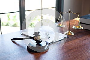 Judge gavel with Justice at law firm in background with legal case document contract, law and justice, attorney, lawsuit