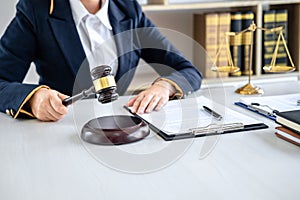 Judge gavel with Justice lawyers, Business woman in suit or lawyer working on a documents in courtroom. Legal law, advice and