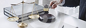 Judge gavel with Justice lawyers, Counselor in suit or lawyer working  with contract papers on a documents in courtroom, Legal law