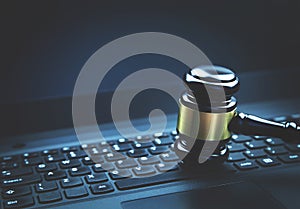 Judge gavel on a laptop. Concept of internet crime. Law and Just