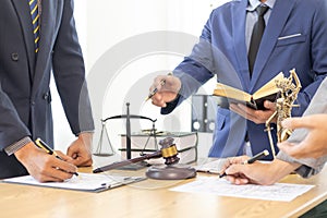 judge gavel in law office is placed on table to symbolize judge deciding lawsuit. gavel wood on wooden table of lawyers in lega photo