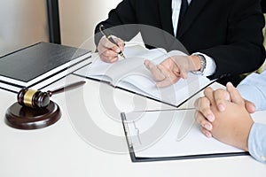 Judge gavel with legal documents, lawyer consulting with business man