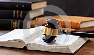 Judge gavel on an open book, wooden desk, law books background