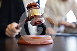 A judge gavel is prepared in the courtroom to be used to give a signal when the verdict is read after the trial is completed.