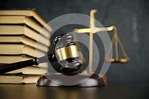 Judge gavel, scales of justice and law books in