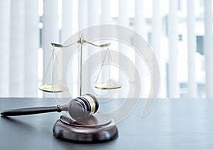 Judge gavel, scales of justice on the office desk, the white background office of a lawyer or judge