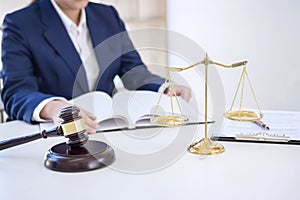 Judge gavel with scales of justice, professional female lawyers