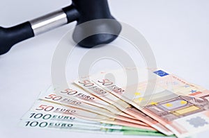 Judge gavel and stack of euro money