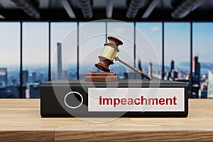 judge gavel standing on black office binder file folder on wooden desk in large modern office building impeachment label skyline
