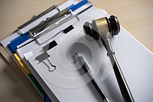 Judge hammer and business report papers, important documents