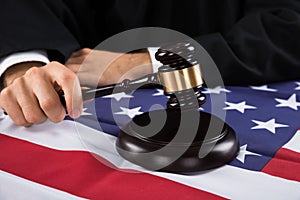 Judge Hands With Gavel And American Flag