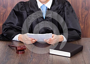 Judge holding documents