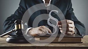 Judge holding paragraph symbol. Law and Justice