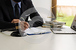 Judge, male lawyer, business consultant legal services and consulting in various contracts to plan a court case hammer and scales