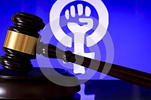 Judge mallet and gender symbol on white background